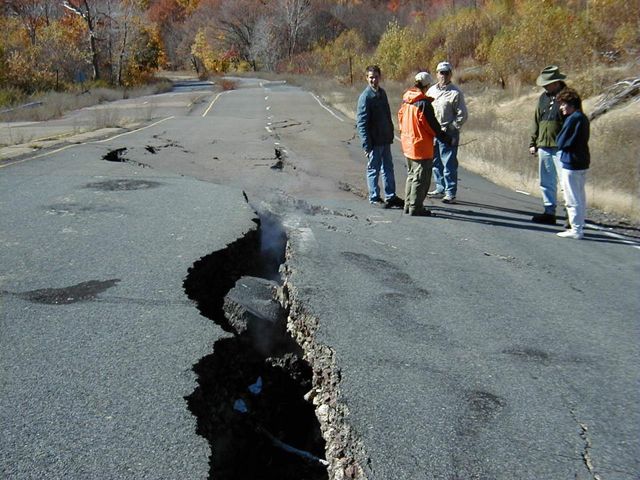 Route 61 near Centralia buckled and cracked by the underground coal fire, seen in fall 2000 with geology students for scale.