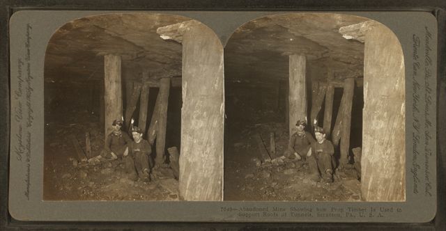 An abandoned anthracite mine near Scranton, Pennsylvania, with prop timbers holding up the roof, from a stereoscopic view published between about 1870 and 1915.